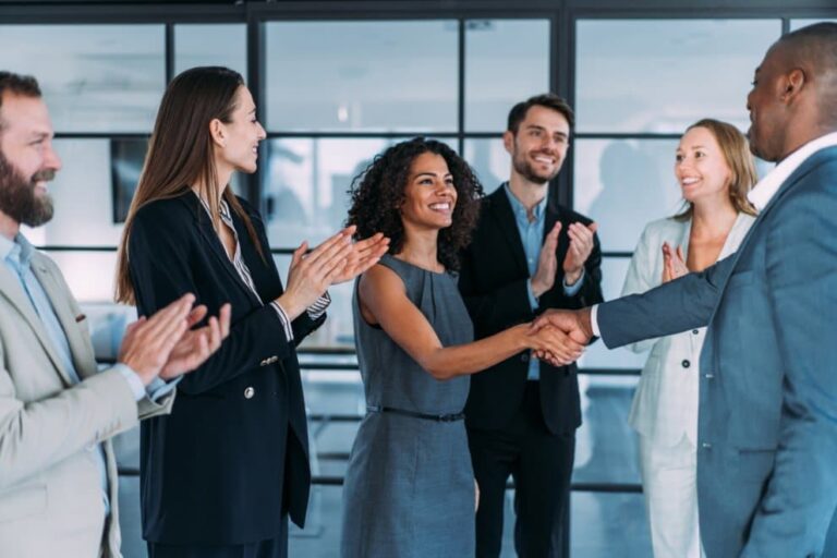 Business Professionals Shaking Hands 768x512